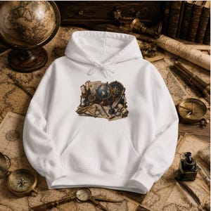 May include: A white hooded sweatshirt featuring a central graphic print of vintage navigational and cartographic tools, including a globe, a compass, an hourglass, a quill pen, and rolled parchment maps arranged on a flat surface.