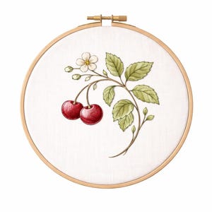 May include: Embroidery hoop with a detailed illustration of cherries and leaves. The design features two ripe red cherries, green leaves, and a delicate white flower. The artwork is set against a white fabric background, framed by a wooden hoop.