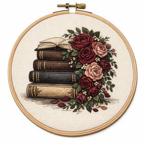 May include: Embroidery hoop featuring a stack of books with a floral arrangement. The books are in shades of brown and black, with gold accents. The flowers are red and pink roses with green leaves, creating a classic, romantic theme.
