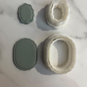 May include: A set of three ceramic mugs with a speckled, matte finish. The mugs are in shades of cream, light gray, and dark gray. Each mug has a simple, minimalist design, perfect for coffee or tea.