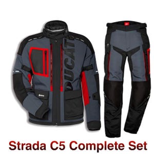 May include: A grey and black motorcycle jacket and trousers set with red detailing. The jacket has the word "DUCATI" and multiple pockets. The trousers have black panels on the knees and red accents. The set is labelled "Strada C5 Complete Set".