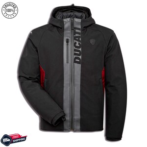 May include: Black Ducati motorcycle jacket with a gray stripe down the center and the brand name printed vertically. The jacket has a hood, a small chest logo, and red accents on the sides. A "Trusted Seller" badge is in the upper left corner.