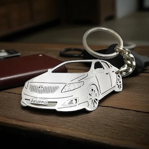 May include: A set of three ceramic mugs with a speckled, matte finish. The mugs are in shades of cream, light gray, and dark gray. Each mug has a simple, modern design and a rounded handle. Perfect for coffee or tea.