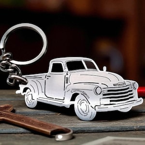 May include: A set of three ceramic mugs with a speckled, matte finish. The mugs are in shades of cream, light gray, and dark gray. Each mug has a simple, minimalist design and a rounded handle.