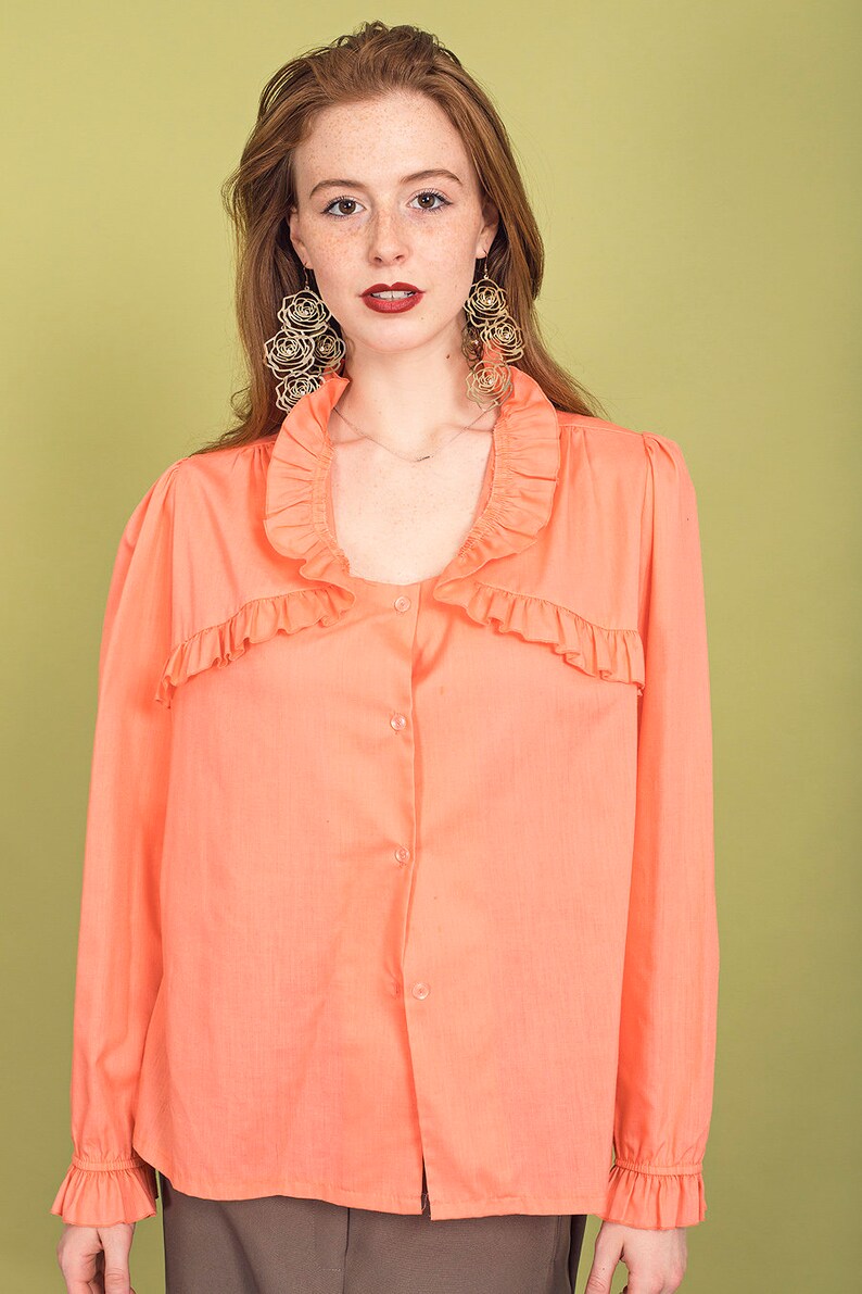 peach ruffle blouse