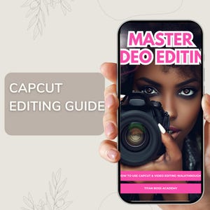 Puede incluir: Un tel&eacute;fono inteligente muestra una gu&iacute;a de edici&oacute;n de video CapCut. La pantalla muestra a una mujer sosteniendo una c&aacute;mara, con el texto "MASTER DEO EDITIN" en rosa. La gu&iacute;a tambi&eacute;n incluye el texto "HOW TO USE CAPCUT & VIDEO EDITING WALKTHROUGH" y "TITAN BOSS ACADEMY."