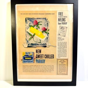 May include: Framed vintage advertisement for Kraft Parkay margarine. The ad features a block of margarine in ice with red flowers, and text promoting "New Sweet Chilled Parkay." Also includes a coupon for free Powers Model Nylons.