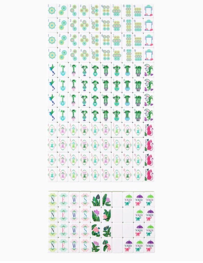 May include: A complete set of white Mahjong tiles with various colorful illustrations. The tiles feature symbols, numbers, and images of flowers, plants, and animals. The set includes tiles with the letters N, E, W, and S, and the word "Joker".