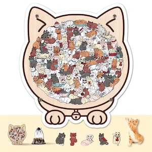 Può includere: Un puzzle in legno a forma di gatto con una moltitudine di gatti illustrati in varie pose e colori. Il puzzle ha una finitura a venatura di legno chiaro e un bordo bianco. Ulteriori oggetti a tema gatto sono visualizzati sotto.