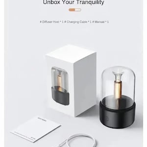 Pu&ograve; includere: Confezione del prodotto con un diffusore nero e trasparente, un cavo di ricarica bianco e un manuale bianco. La confezione riporta la scritta "Product packaging Unbox Your Tranquility". Il diffusore ha un interno dorato.