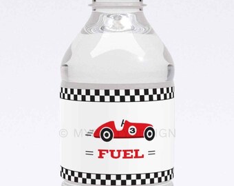 May include: A white plastic water bottle with a black and white checkered label. The label features a red race car with the text "= FUEL =" in black.