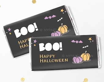 May include: Two black Halloween-themed chocolate bar wrappers with the word "BOO!" in white. The wrappers also feature the text "HAPPY HALLOWEEN", along with illustrations of pumpkins, bats, and stars.
