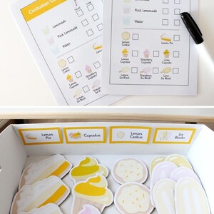 May include: A printable customer order form for a lemonade stand with a variety of lemon-themed treats, including lemonade, pink lemonade, water, lemon pie, lemon cookies, lemon cupcakes, and lemon ice blocks. The form has checkboxes for each item and includes a space for the customer to write their name.