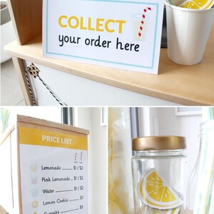 May include: A wooden play stand with a yellow sign that says "PRICE LIST" and lists the prices for lemonade, pink lemonade, water, lemon cookie, cupcake, lemon pie, and ice block. The stand also has a sign that says "COLLECT your order here" and a glass jar filled with yellow lemon slices.