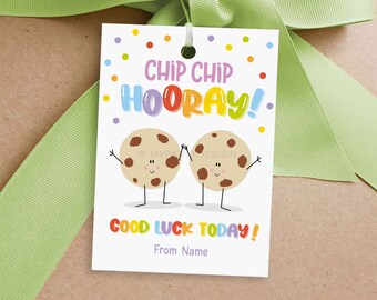 May include: A white gift tag with a colorful "Chip Chip Hooray!" message and two cartoon cookies holding hands. The tag also says "Good Luck Today!" and "From Name".