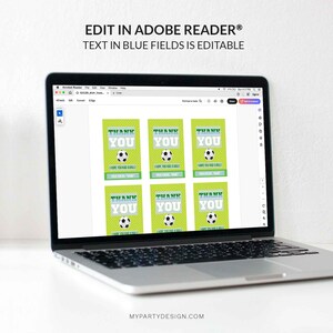 May include: A laptop displays soccer-themed thank you cards. Each card features a soccer ball graphic, the words "THANK YOU," and editable fields. The cards have a green background with white stripes and are designed for easy customization.