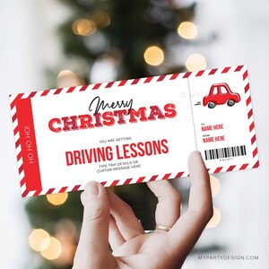 May include: A Christmas-themed gift certificate for driving lessons. The red and white ticket features the words "Merry Christmas" and "Driving Lessons." A small red car graphic is on the right side. The ticket is held by a hand.