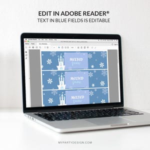 May include: A laptop displays a blue and white design for bottle labels. The labels feature a castle, snowflakes, and the text "Melted Snow." The top of the screen reads "Edit in Adobe Reader&reg; Text in Blue Fields is Editable."