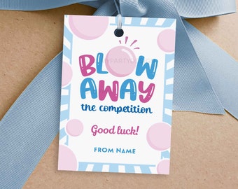 May include: A blue and white striped gift tag with pink and blue bubbles. The tag says "Blow Away the competition" and "Good luck!" with a space for a name.