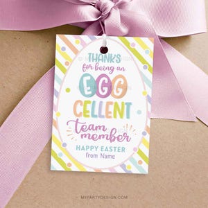 May include: A colourful Easter gift tag with a striped background and confetti. The tag says "Thanks for being an Egg-cellent team member. Happy Easter from Name."
