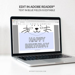 May include: A laptop computer screen displaying a printable coloring page featuring a cartoon kitten with the text "HAPPY BIRTHDAY" on a blue background. The text "EDIT IN ADOBE READER&reg; TEXT IN BLUE FIELDS IS EDITABLE" is displayed at the top of the screen.