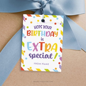 May include: A colourful gift tag with the text "Hope your birthday is extra special!" and a space for a name. The tag has a rainbow striped border and colourful polka dots.