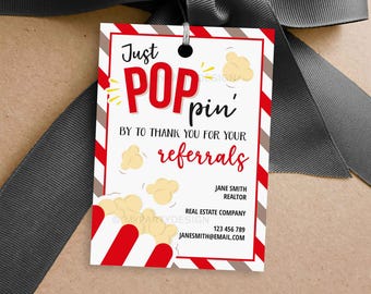 May include: Red and white striped gift tag with a popcorn design and the text "Just POPpin' by to thank you for your referrals". The tag also includes the name Jane Smith, Realtor, Real Estate Company, phone number and email address.
