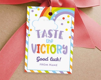 May include: A colorful gift tag with a rainbow, clouds, and the text "Taste the Victory" and "Good luck! From Name".