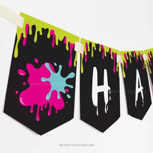 May include: A black and green banner with the word "Happy" in white letters. The banner has a dripping paint effect with pink, blue, and green paint splatters.