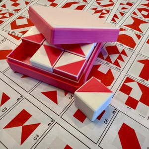 May include: A set of three ceramic mugs with a speckled, matte finish. The mugs are in shades of cream, light grey, and dark grey. Each mug has a simple, minimalist design, ideal for coffee or tea.