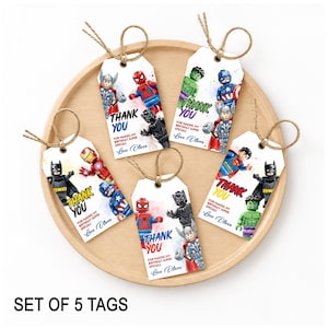 May include: A set of five rectangular white gift tags featuring colourful illustrations of various superhero action figures. Each tag includes the printed text THANK YOU FOR MAKING MY BIRTHDAY SUPER SPECIAL! and Love Oliver, with brown twine loops.