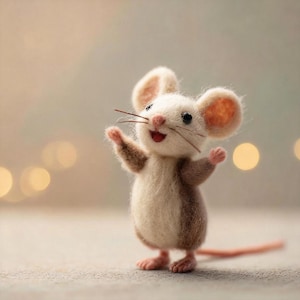 May include: A handcrafted felt mouse figurine with a cheerful expression. The mouse has a white body, brown accents, and pink details on its ears, paws, and tail. Its arms are raised, and it has a red mouth, giving it a friendly appearance.
