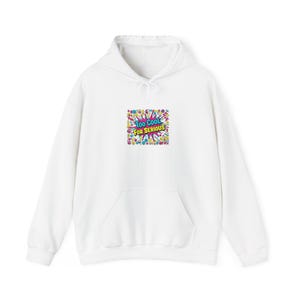 May include: White hoodie with a front pocket and drawstring hood. The hoodie features a colourful graphic that reads "Too Cool For Serious" in a comic book style. The graphic includes flowers and stars.