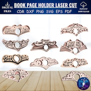 May include: A collection of laser-cut wooden book page holders with various designs and quotes. The holders feature phrases like "Reading is my superpower" and "A good book is always too short." The image also includes text that says "Book Page Holder Laser Cut."