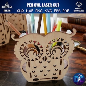 May include: A laser-cut wooden owl-shaped pen holder. The holder is made of light-colored wood and features cut-out details for the eyes and feathers. The text "PEN OWL LASER CUT" is visible. The holder contains pens and pencils.