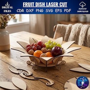 Puede incluir: Un frutero de madera cortado con láser en forma de flor, lleno de uvas, naranjas, nueces y una manzana. El texto "FRUIT DISH LASER CUT" está en la parte superior. El frutero está sobre una mesa de madera. Descarga instantánea de archivos digitales.