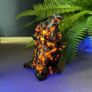 Hand Carved Yooperlite Godzilla Sculpture, UV Reactive Crystal Decor
