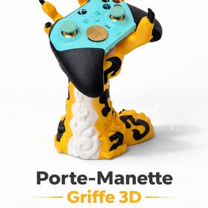 Peut inclure: Support de manette en forme de griffe jaune et noire tenant une manette de jeu turquoise et noire. Le support a une base blanche et le texte "Porte-Manette Griffe 3D" est en bas. Imprimé en 3D.
