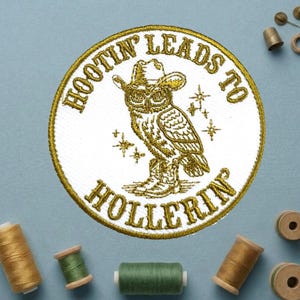 May include: Embroidered patch with a gold border and the text "Hootin' Leads to Hollerin'". The patch features a detailed owl wearing a cowboy hat and boots. The owl is in gold thread on a white background.