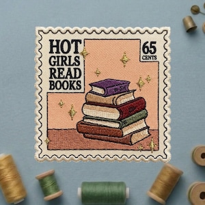 May include: Embroidered patch in a postage stamp design with the text "HOT GIRLS READ BOOKS" and "65 CENTS". The patch features a stack of books in various colors, with gold star accents on a peach background.