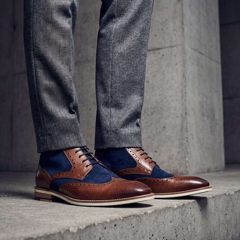 Profile view of the lace-up closure and soft navy suede texture on a bespoke men's dress boot.