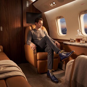Stylish mens blue boots paired with charcoal grey wool trousers for a modern look.