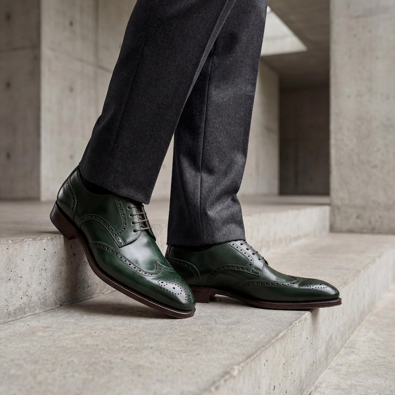 Luxury men's green leather oxfords styled with a charcoal grey wool suit.