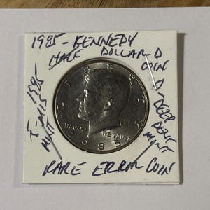 1985 - Moneda de medio dólar Kennedy D - Error raro