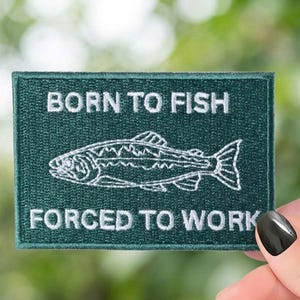 May include: A rustic wooden sign with the text "Welcome to our home" in white lettering. The sign features a distressed finish and a simple, inviting design, perfect for front door decor.