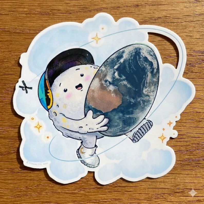 May include: A whimsical sticker featuring a cartoon moon character wearing a cap and sneakers, hugging a globe. The moon is white with a smiling face, set against a blue cloud background with stars.