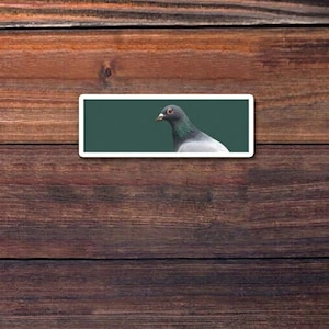 May include: A set of three ceramic canisters with lids. The canisters are white with a textured surface and feature a geometric pattern in shades of blue and gray. The lids are a matching blue.