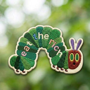 May include: A set of three ceramic mugs with a speckled, matte finish. The mugs are in shades of cream, light gray, and dark gray. Each mug has a simple, minimalist design, perfect for coffee or tea.