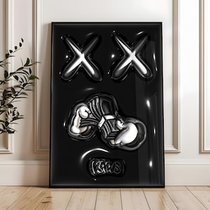 May include: A rectangular black wall art piece featuring a glossy, three-dimensional relief design. The artwork displays two large silver X shapes at the top, a central silver graphic of cartoon-style gloved hands, and the text KAWS at the bottom.