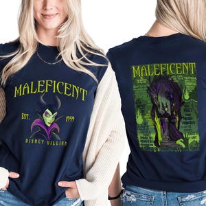 May include: Navy blue t-shirt with the word "MALEFICENT" in yellow, and a graphic of the Disney villain. The front of the shirt also includes "EST. 1959" and "DISNEY VILLIAN". The back of the shirt has a graphic of Maleficent with text.